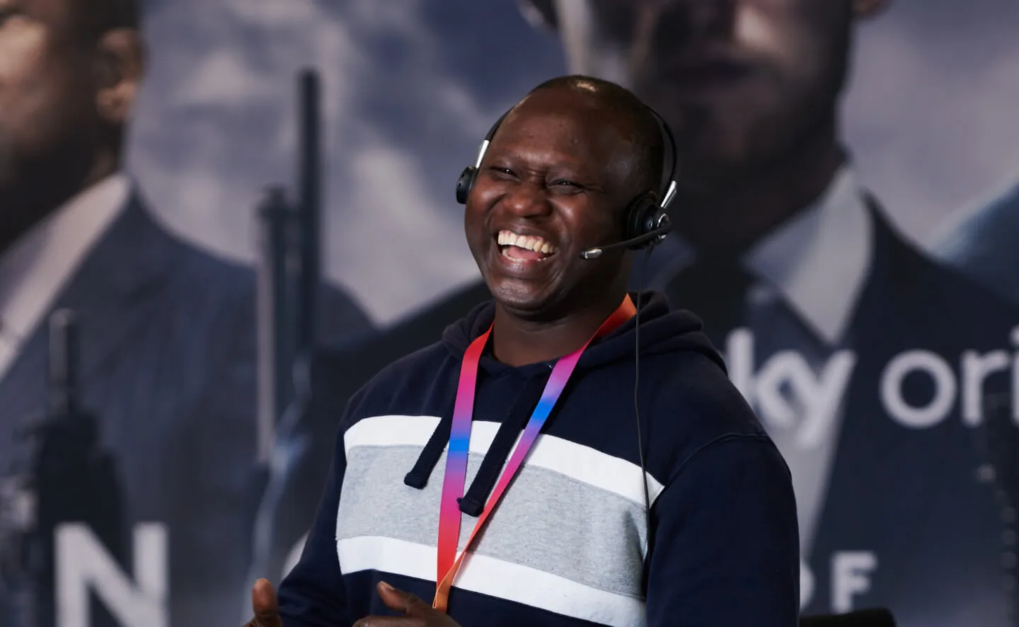 Laughing black man wearing a headset